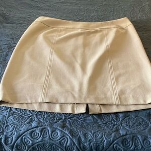 Short skirts over the knees .